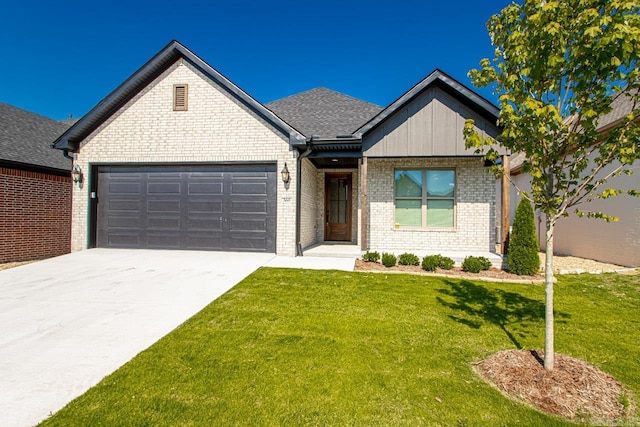 view of front of house with a garage and a front yard