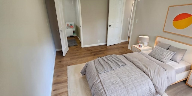 bedroom featuring wood-type flooring