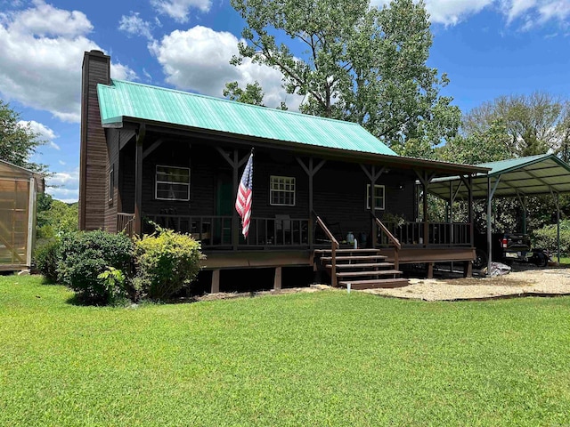 view of front facade with a carport and a front yard