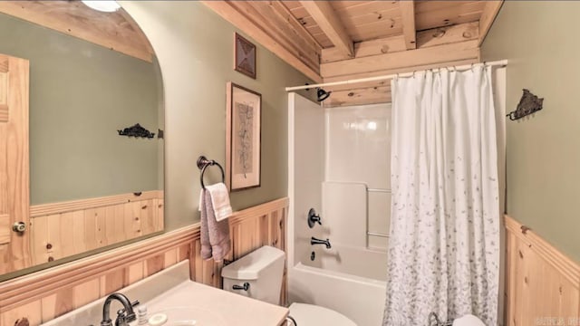 bedroom featuring wood walls and beam ceiling