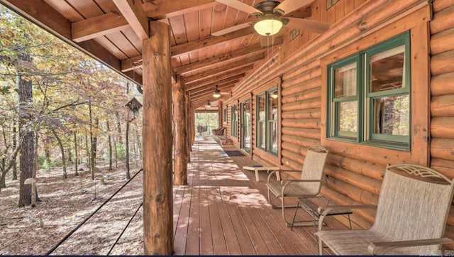 wooden deck featuring a grill