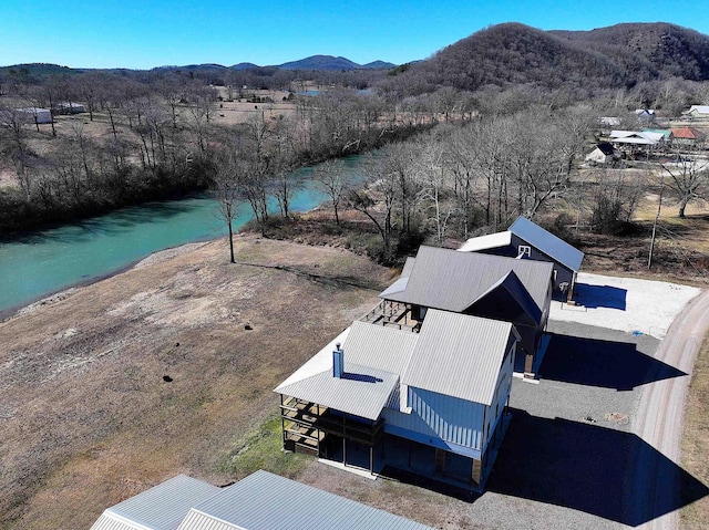 birds eye view of property with a mountain view