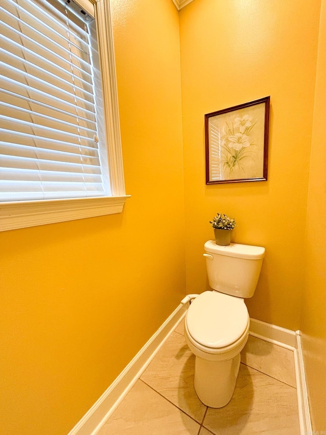 bathroom featuring tile patterned flooring and toilet