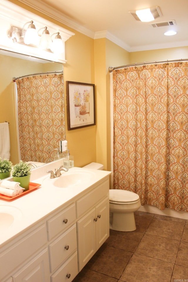 bathroom with vanity, crown molding, tile patterned flooring, and toilet