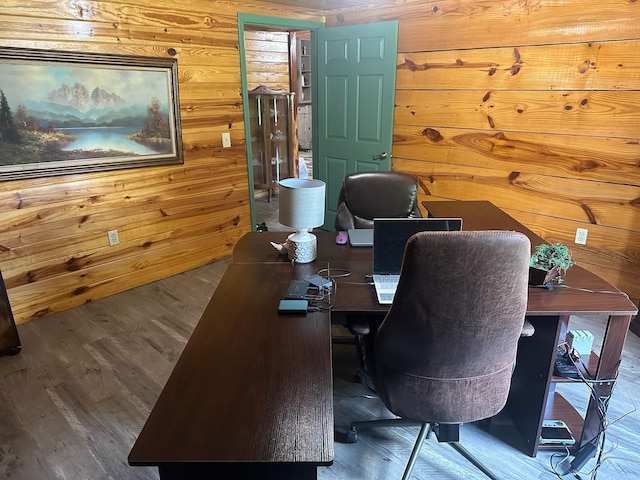 office area featuring wood walls and wood-type flooring