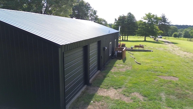 exterior space featuring cooling unit and an outbuilding