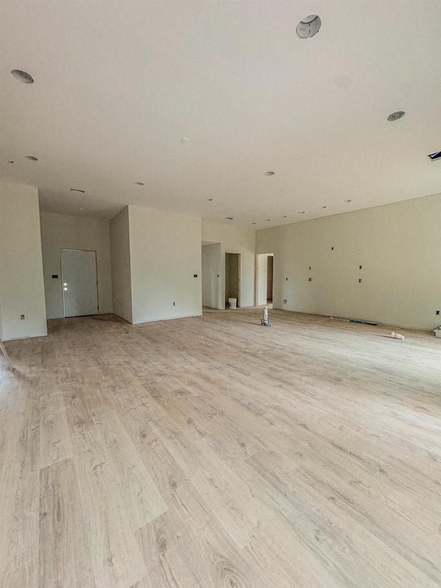 unfurnished room with light hardwood / wood-style floors