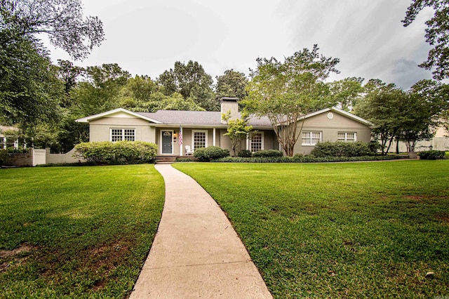 ranch-style house with a front lawn