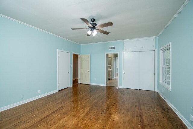 unfurnished bedroom featuring ceiling fan, wood-type flooring, and ornamental molding