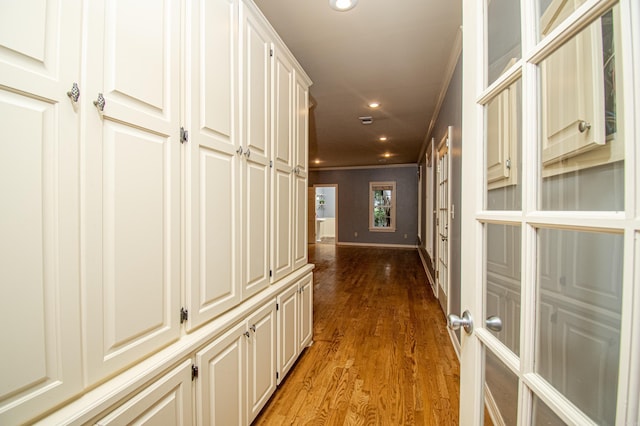 hall with recessed lighting, baseboards, french doors, ornamental molding, and light wood-type flooring