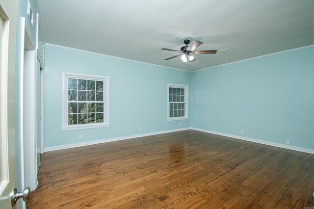 empty room featuring crown molding, hardwood / wood-style floors, and ceiling fan