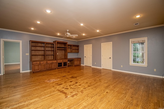 unfurnished living room with crown molding, light wood-type flooring, and ceiling fan