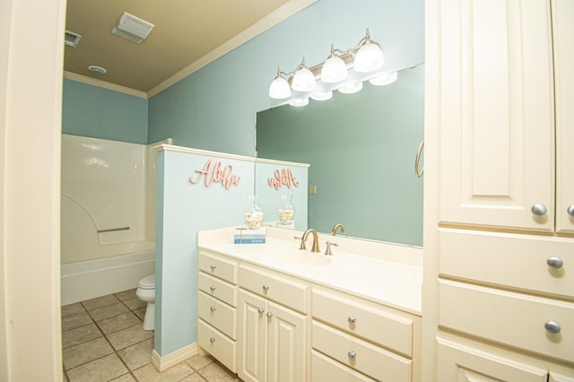 full bathroom featuring washtub / shower combination, tile patterned flooring, crown molding, toilet, and vanity