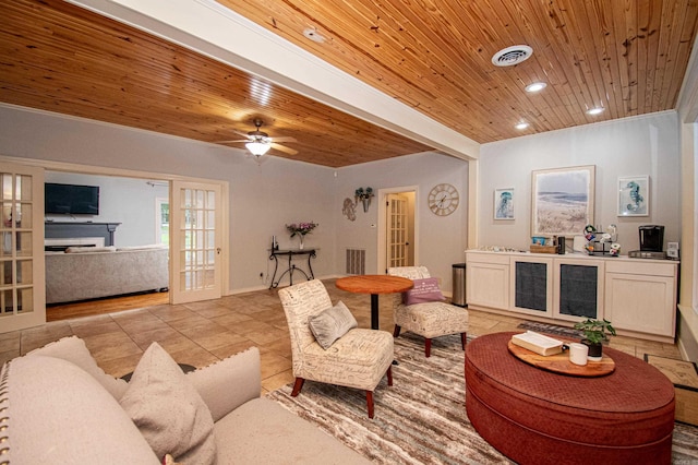 living room with french doors, light tile patterned flooring, wooden ceiling, and visible vents