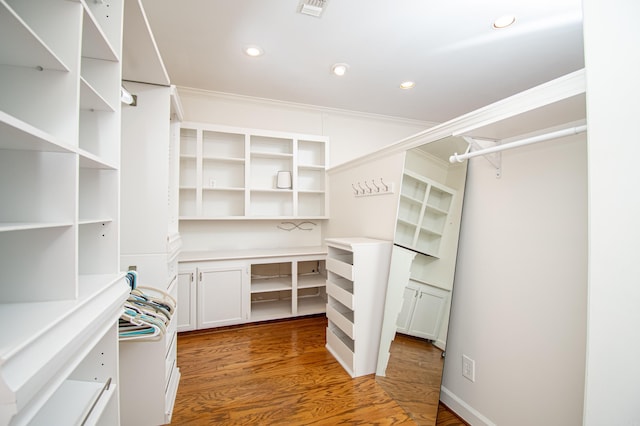 spacious closet with wood finished floors and visible vents