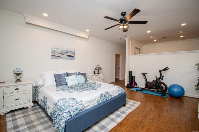 bedroom featuring ornamental molding, ceiling fan, and hardwood / wood-style floors