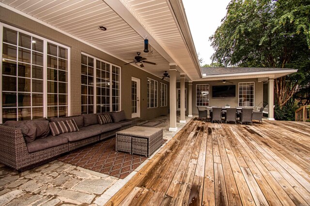 deck featuring ceiling fan and an outdoor hangout area