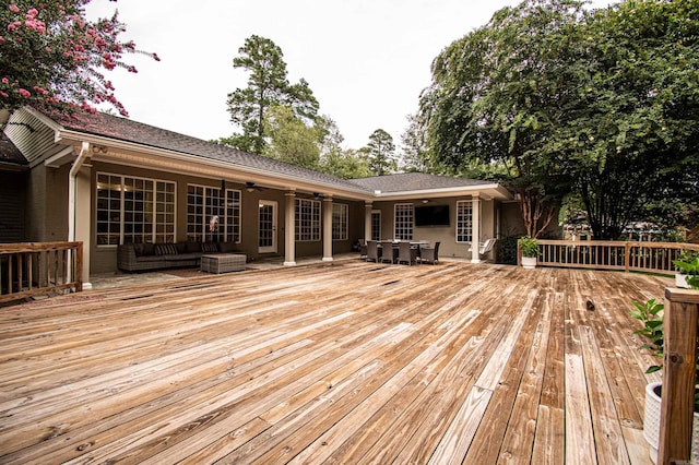 wooden terrace featuring ceiling fan