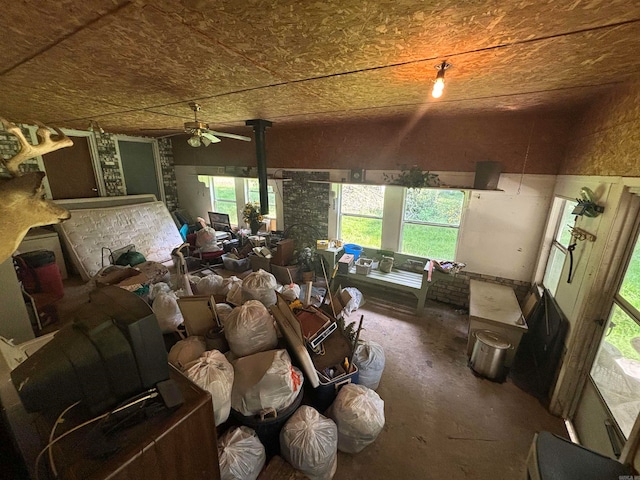 miscellaneous room with concrete flooring and ceiling fan