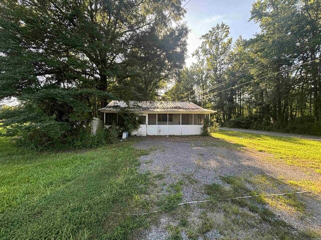 view of front of property with a sunroom