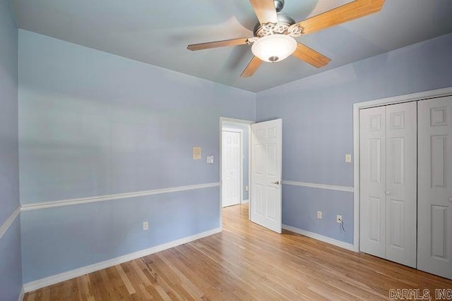 254 S Enid Ave, Russellville, AR 72801 - unfurnished bedroom featuring light wood-type flooring, ceiling fan, and a closet