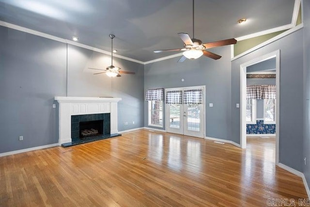 254 S Enid Ave, Russellville, AR 72801 - unfurnished living room featuring light hardwood / wood-style floors, a tile fireplace, crown molding, and ceiling fan