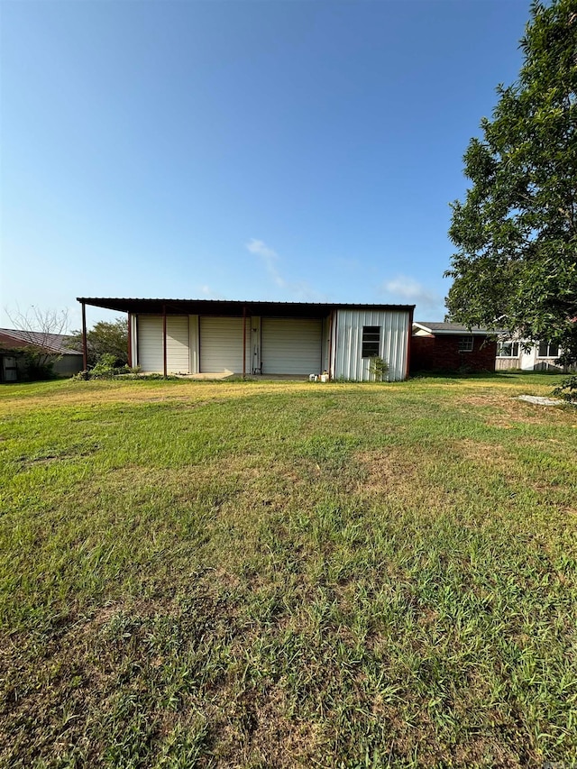 back of property featuring a lawn