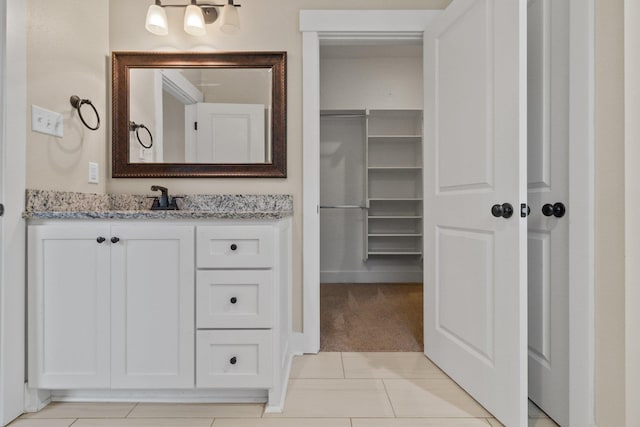 bathroom featuring vanity and tile patterned flooring