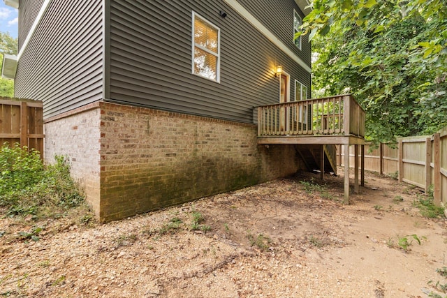 view of property exterior featuring a deck