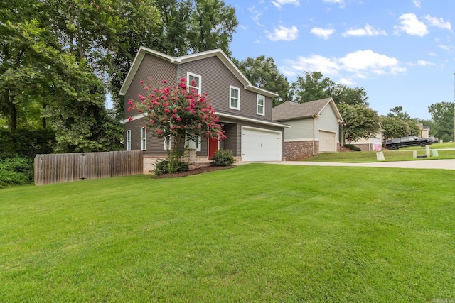 view of front of home with a garage and a front lawn