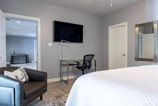 bedroom with hardwood / wood-style flooring