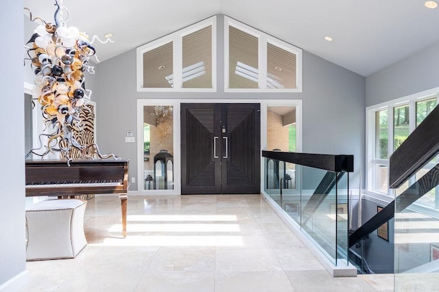 foyer with an inviting chandelier and a high ceiling