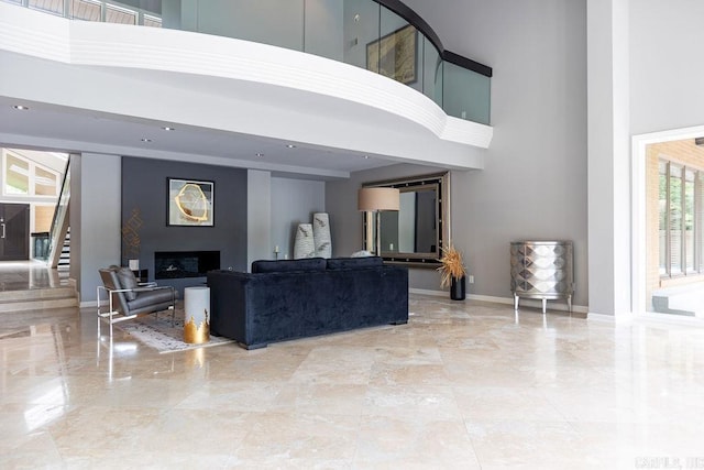 living room with a high ceiling