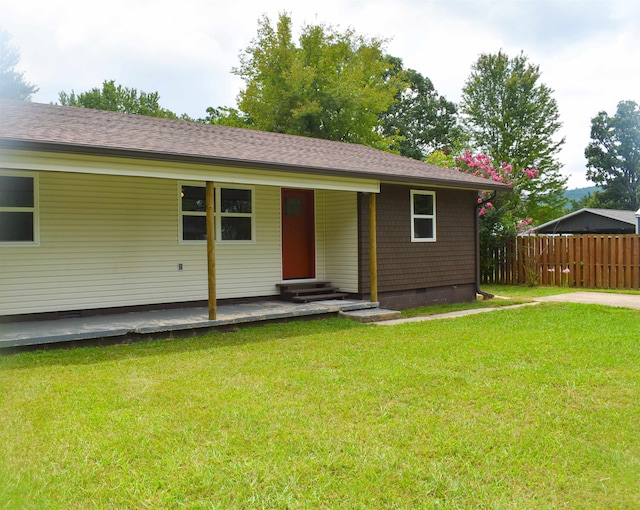 ranch-style house with a front lawn