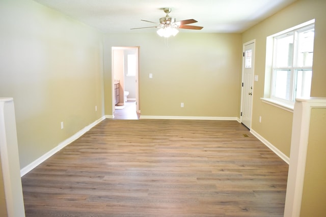 spare room featuring ceiling fan and light hardwood / wood-style flooring