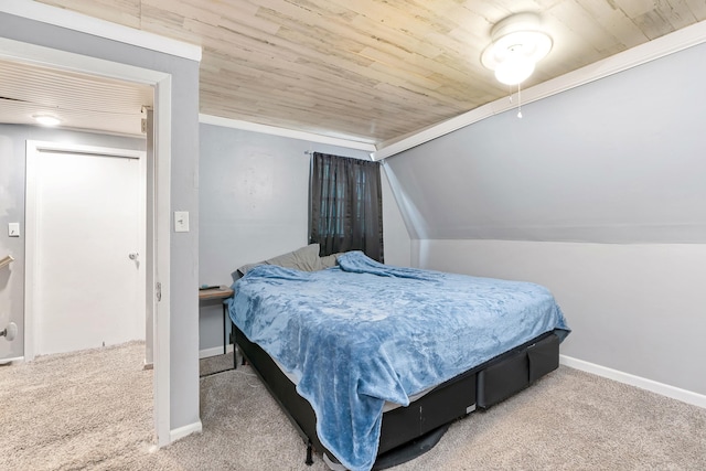 bedroom with vaulted ceiling, wooden ceiling, and carpet flooring