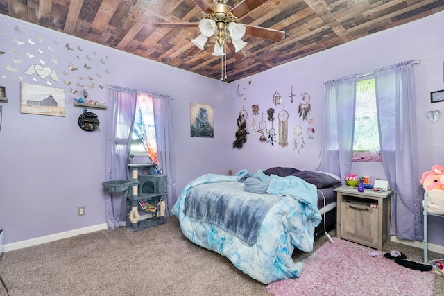 bedroom featuring ceiling fan, carpet, and wooden ceiling