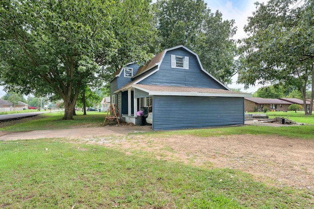 view of home's exterior featuring a yard