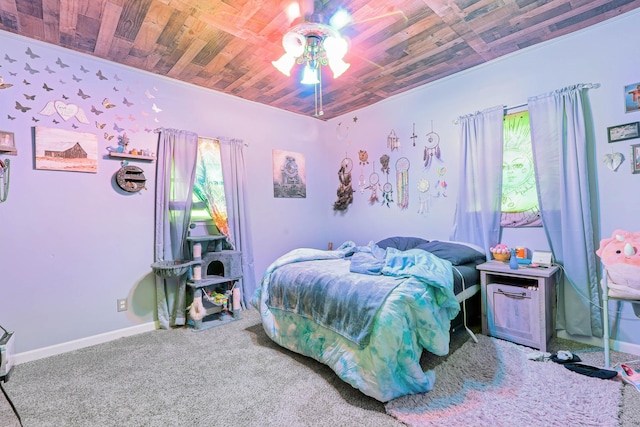 carpeted bedroom featuring multiple windows, wooden ceiling, and ceiling fan