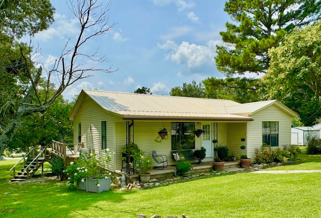 view of front facade with a porch and a front lawn