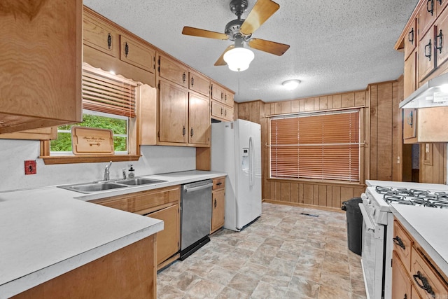 kitchen featuring ceiling fan, white appliances, sink, a textured ceiling, and light tile patterned floors