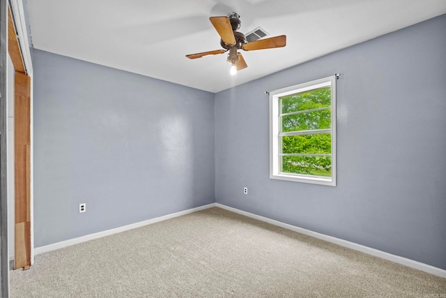 unfurnished room featuring carpet and ceiling fan