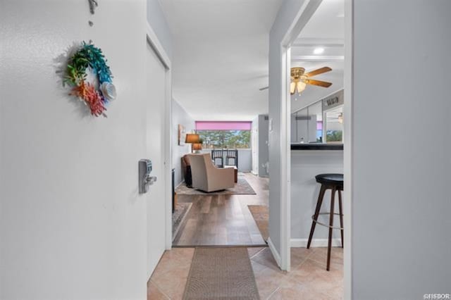 hallway with light tile patterned floors