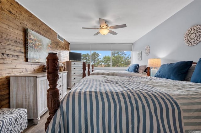 bedroom with hardwood / wood-style flooring and ceiling fan