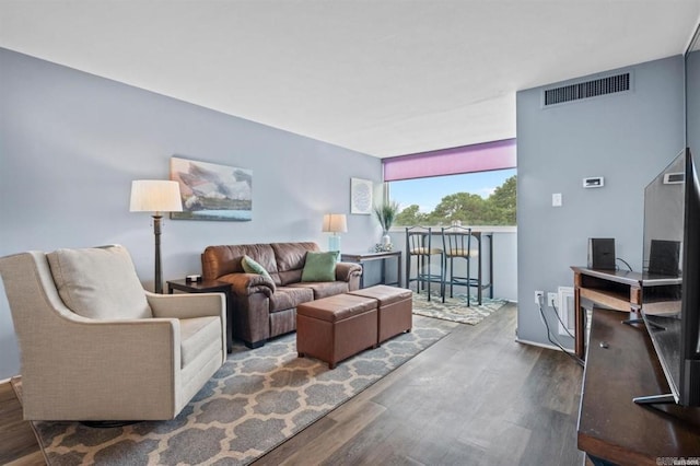 living room with dark hardwood / wood-style floors