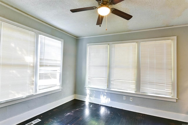 spare room with ceiling fan, dark wood-type flooring, and a textured ceiling