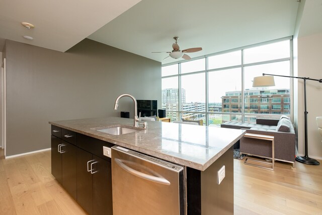 300 Third Unit 708, Little Rock, AR 72201 - kitchen featuring dishwasher, a sink, light wood-type flooring, ceiling fan, and expansive windows