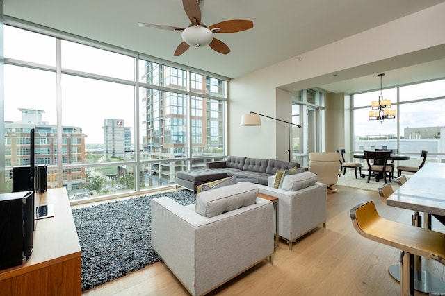 300 Third Unit 708, Little Rock, AR 72201 - living area featuring expansive windows, a ceiling fan, healthy amount of natural light, light wood-style flooring, and a chandelier