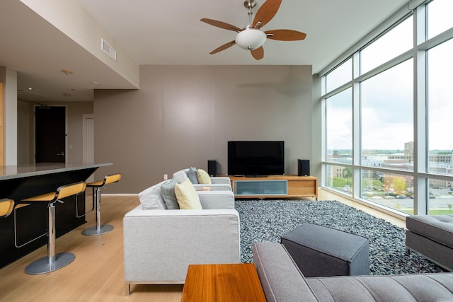 300 Third Unit 708, Little Rock, AR 72201 - living area featuring plenty of natural light, light wood-style floors, and ceiling fan