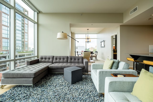 300 Third Unit 708, Little Rock, AR 72201 - carpeted living area with a chandelier and baseboards
